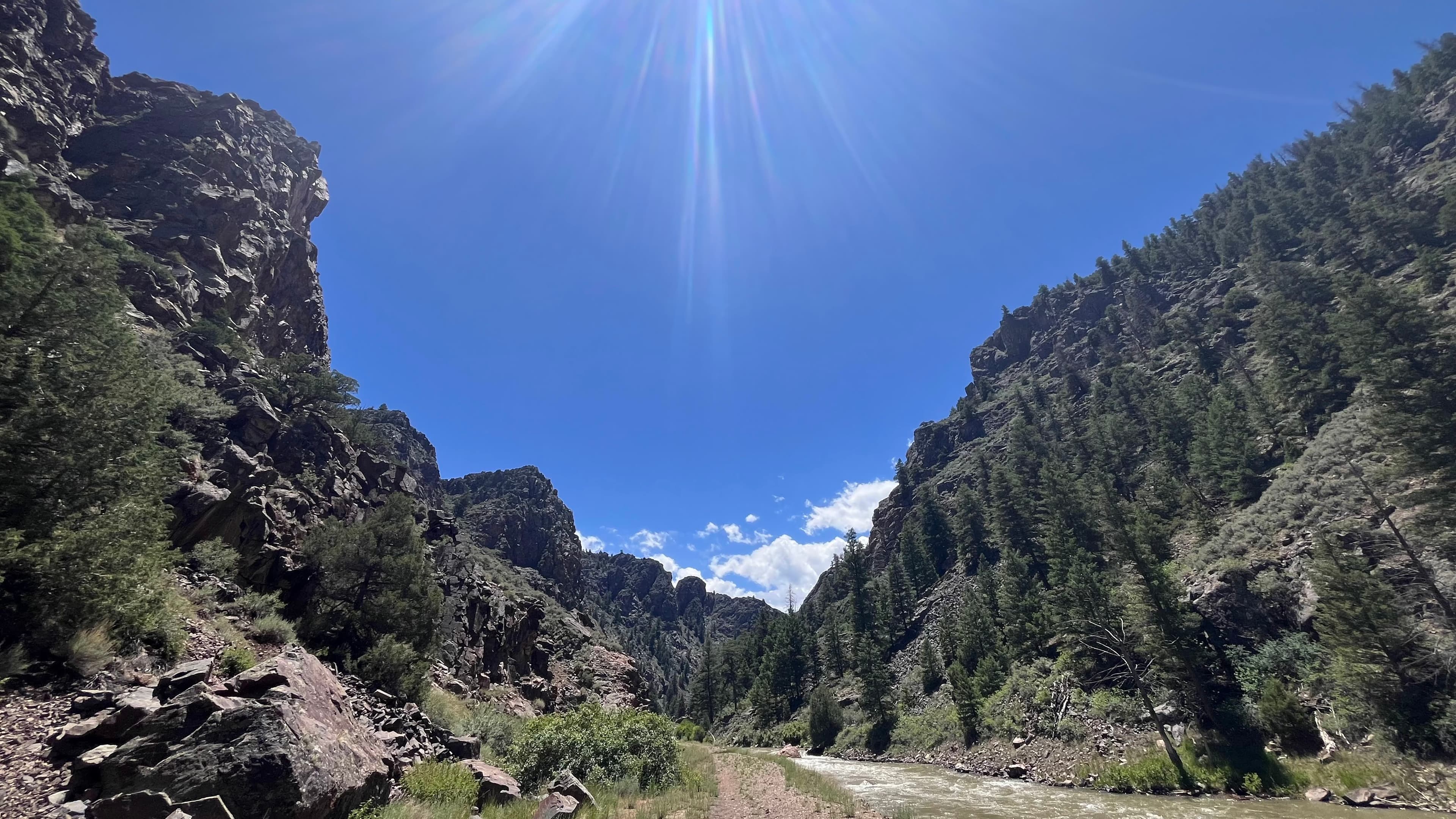 Rocky canyon with river and blue sky