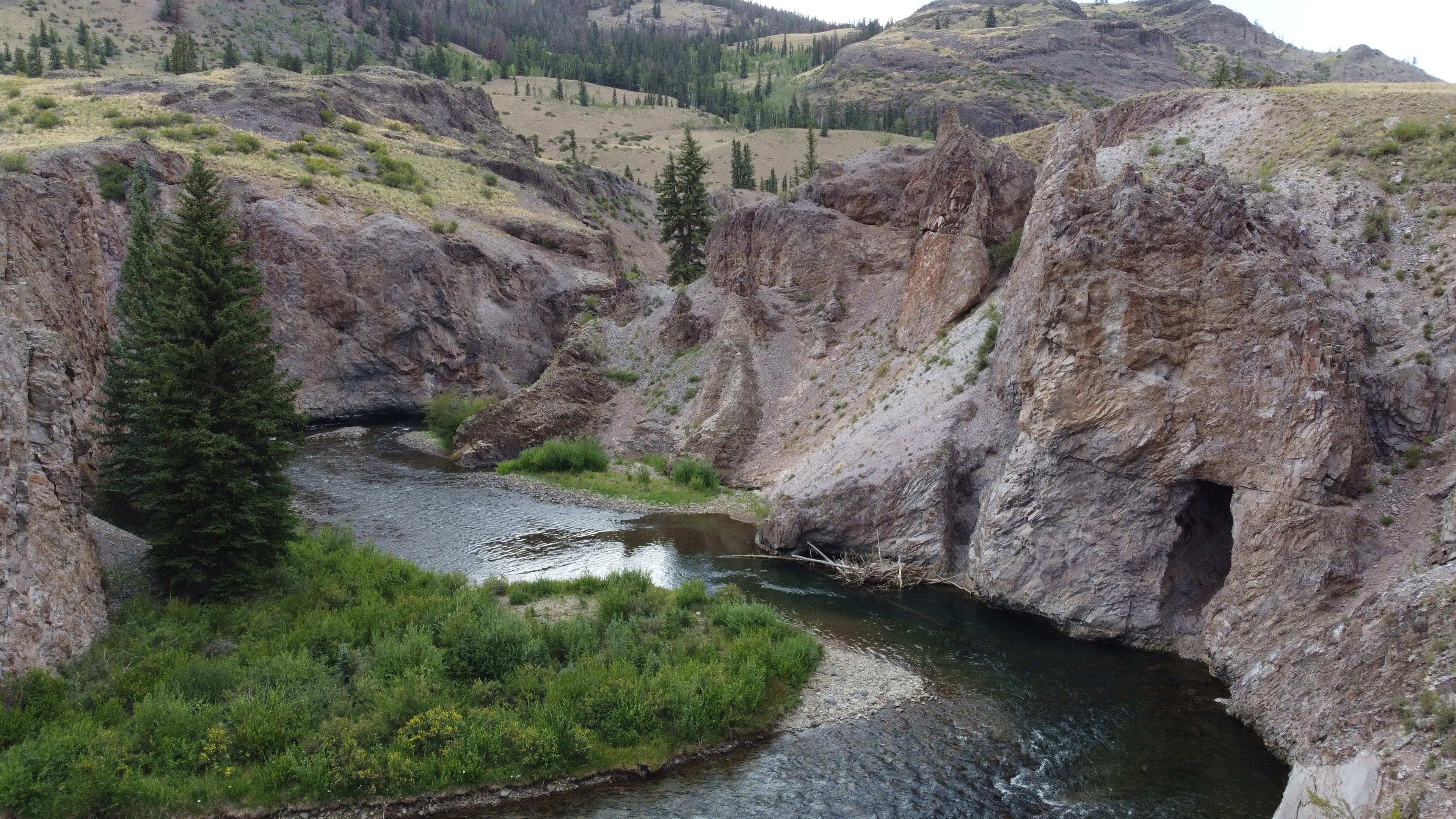 Aerial view of river winding through rocky canyon