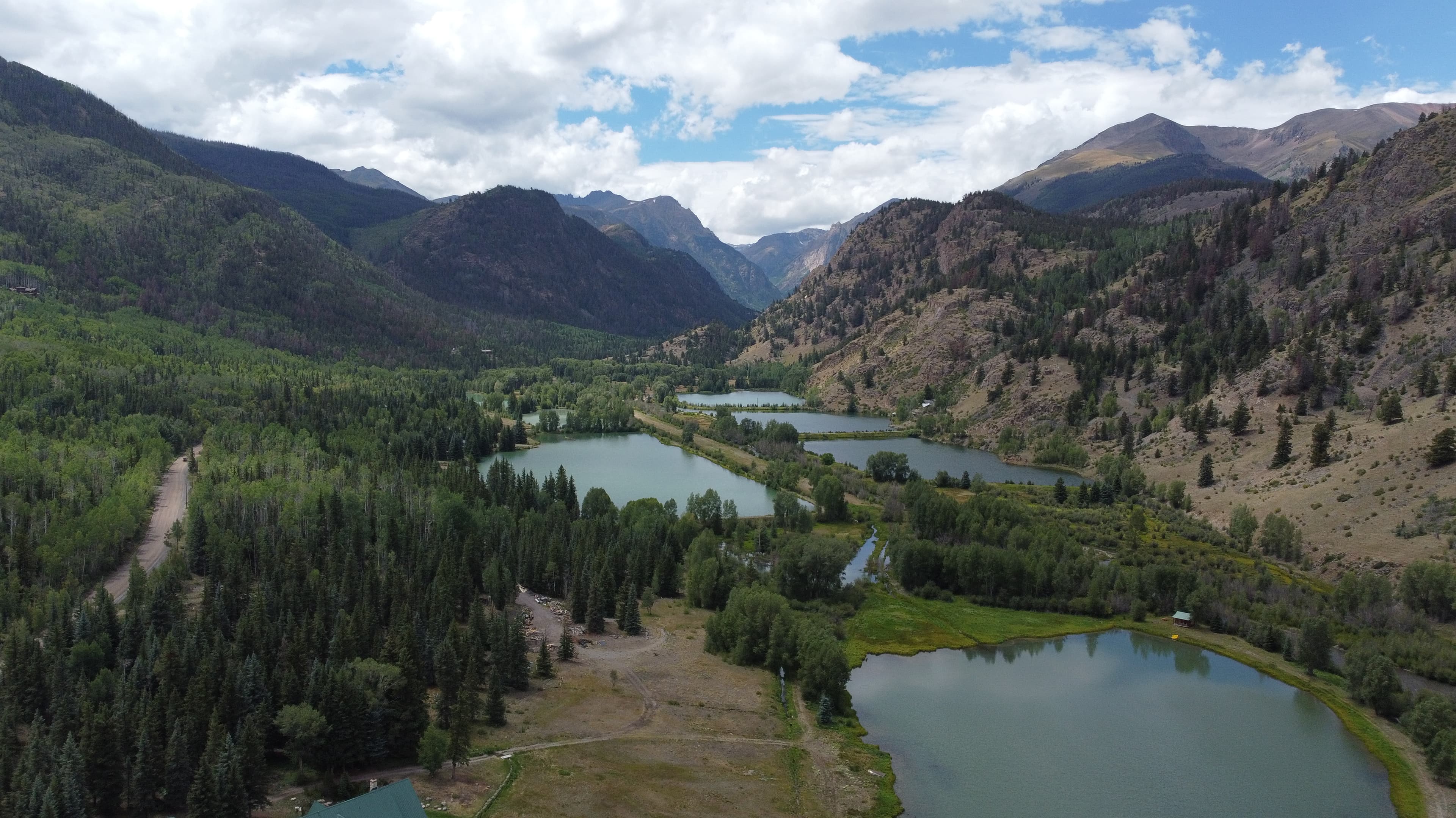 Aerial view of mountain valley with chain of lakes