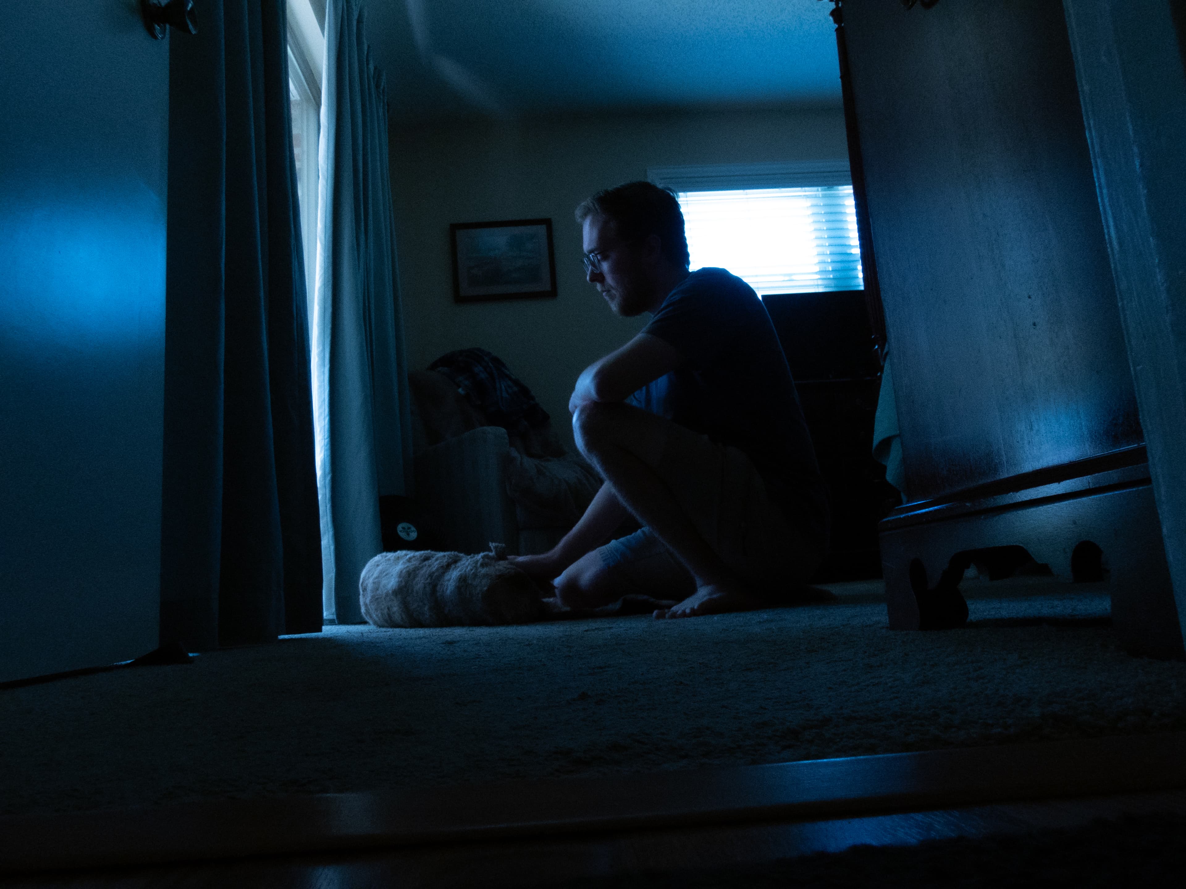 Quiet moment on the floor in cool blue light