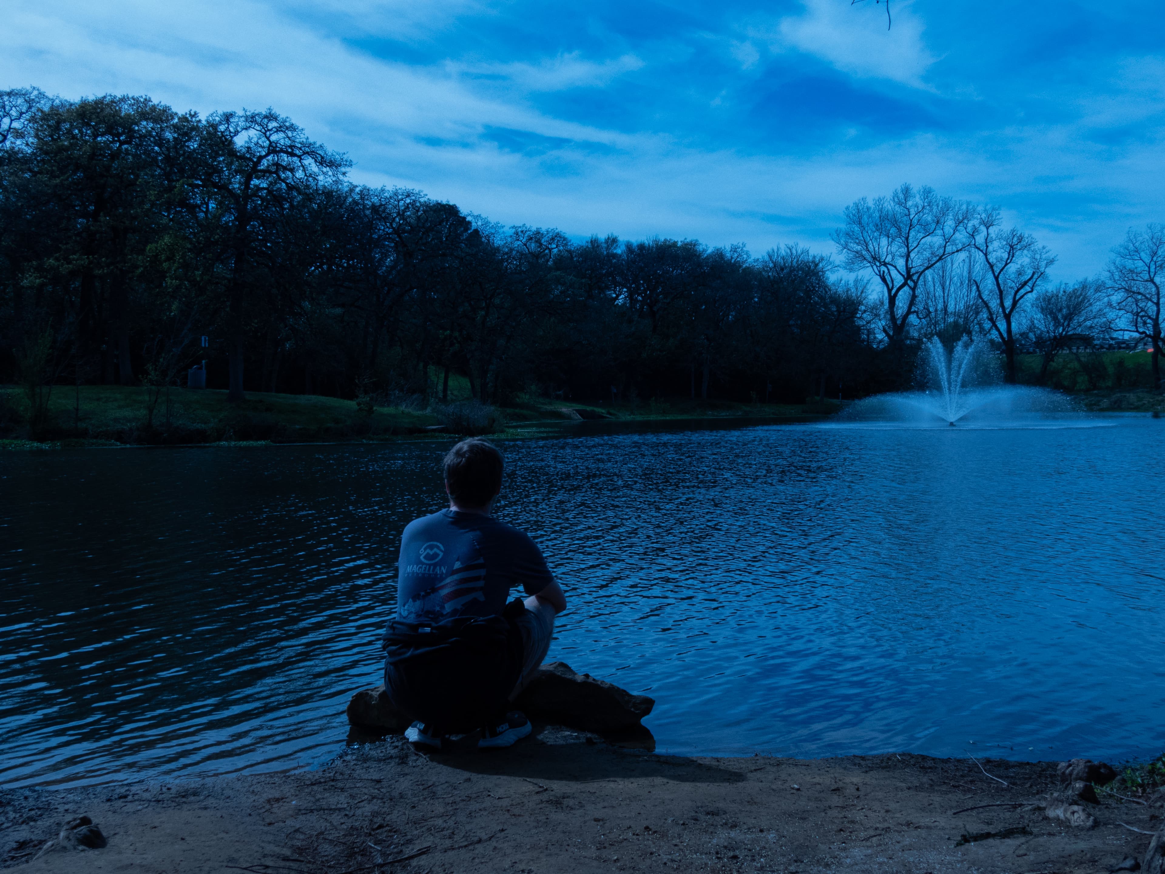 Sitting by the pond at blue hour while the fountain runs